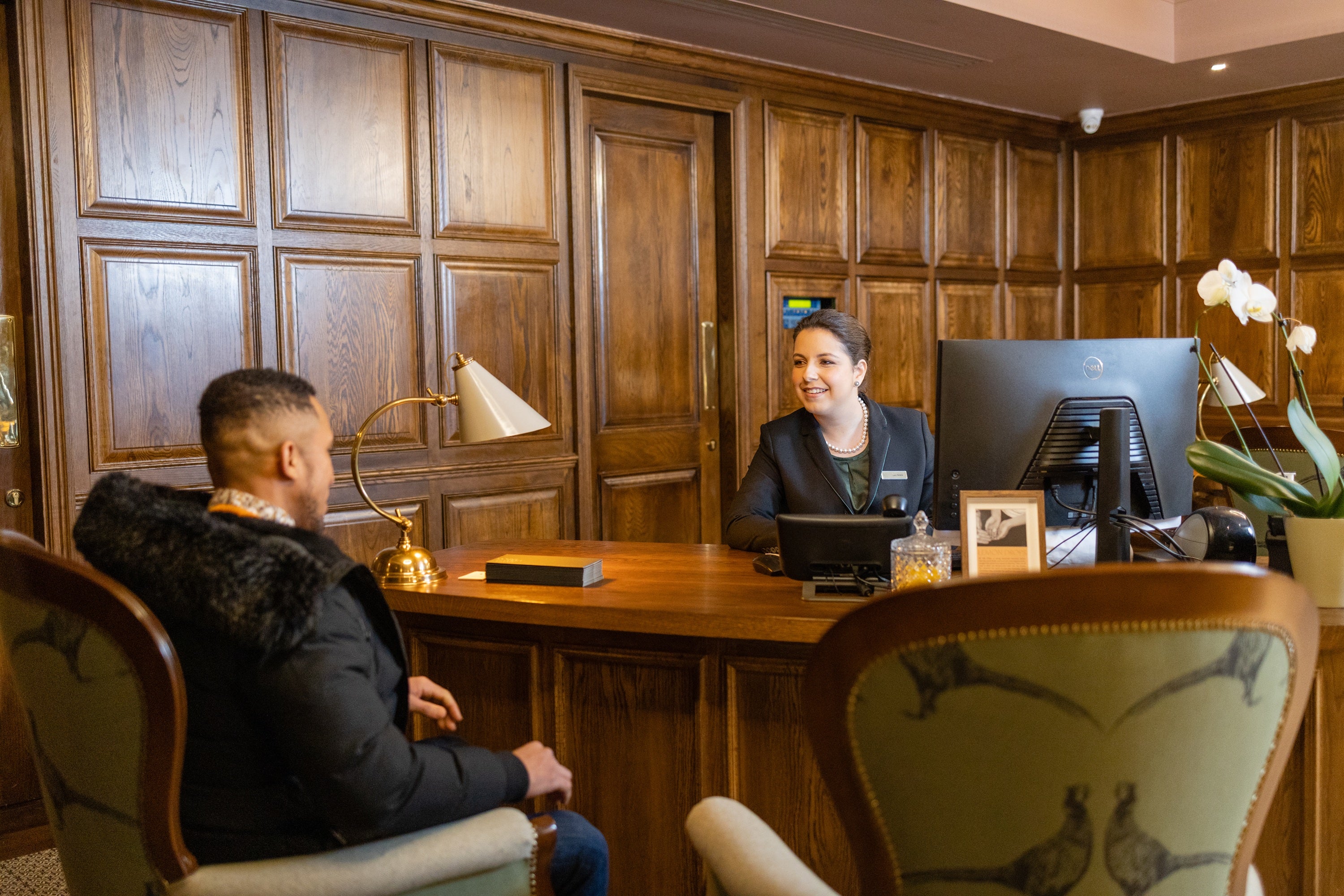 A woman at a reception desk