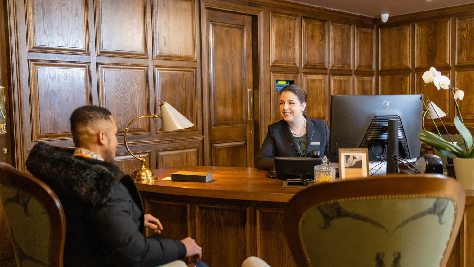 A woman at a reception desk