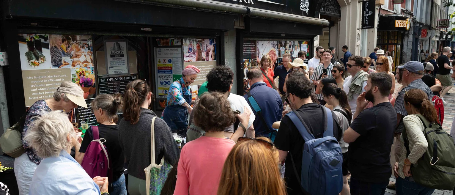 A group of people standing outside a store