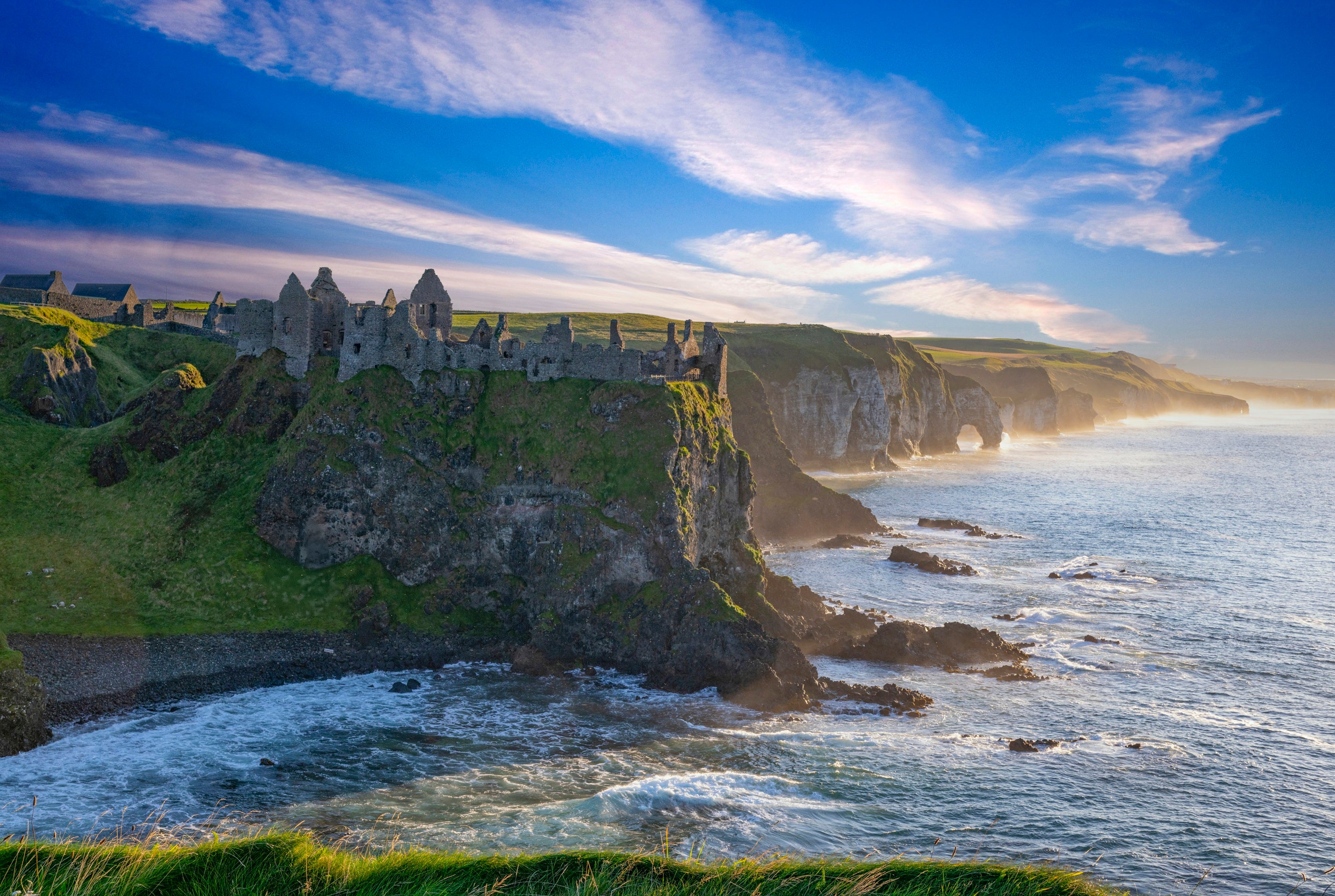 A castle on a cliff by the ocean