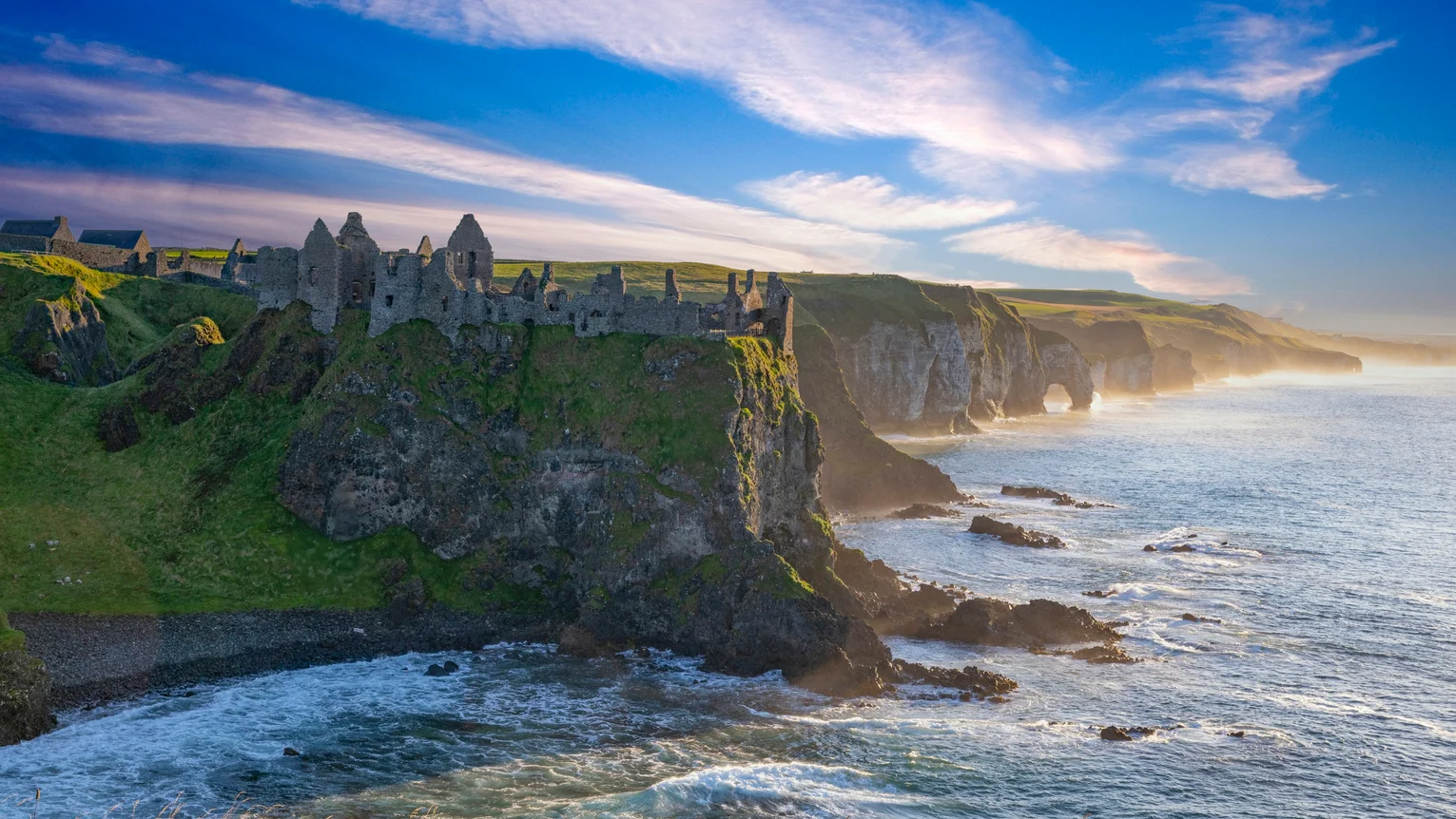 A castle on a cliff by the ocean