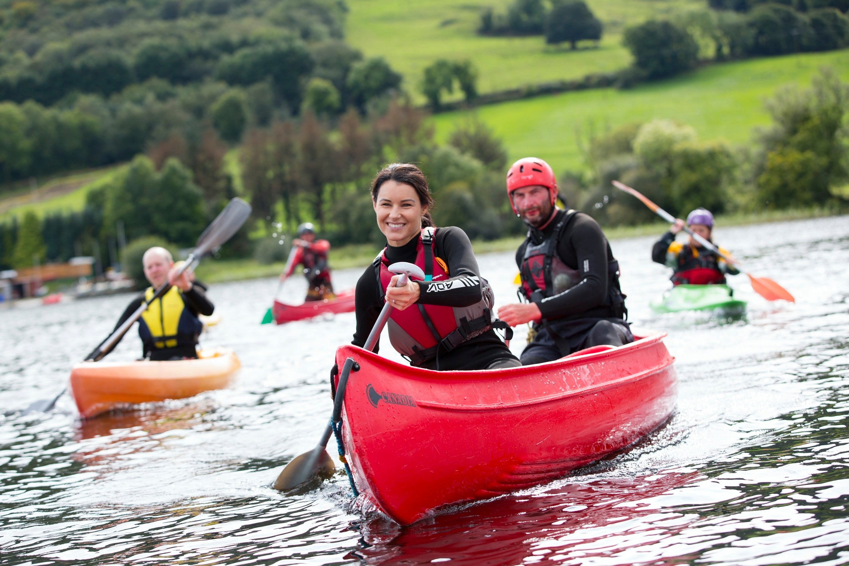 A group of people in a canoe on a river