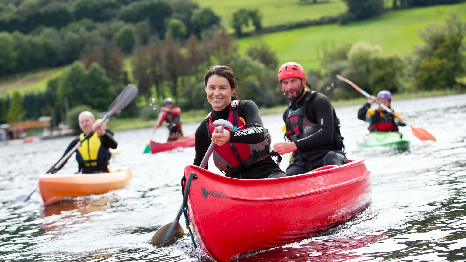 A group of people in a canoe on a river