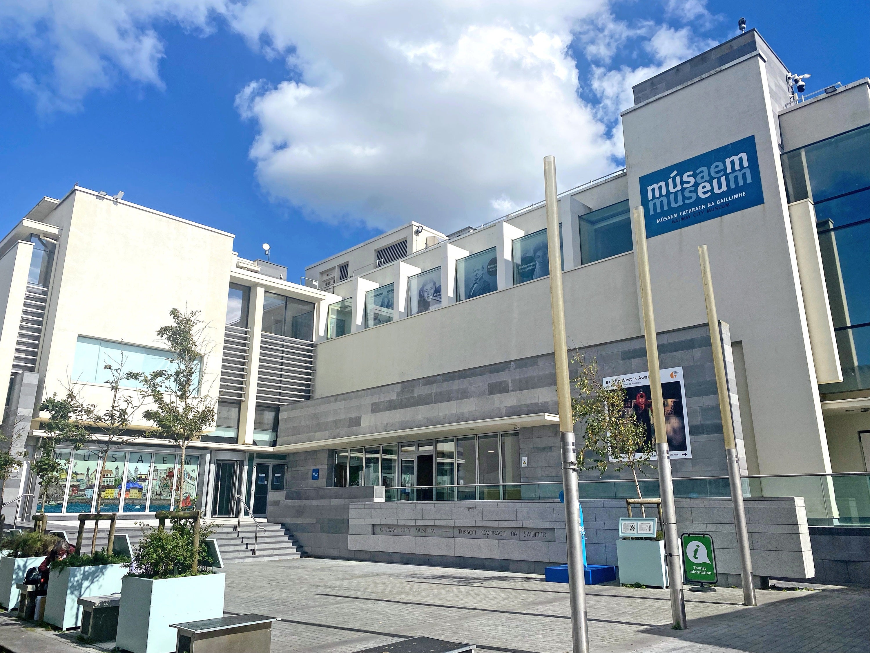 A museum building with a sign on it