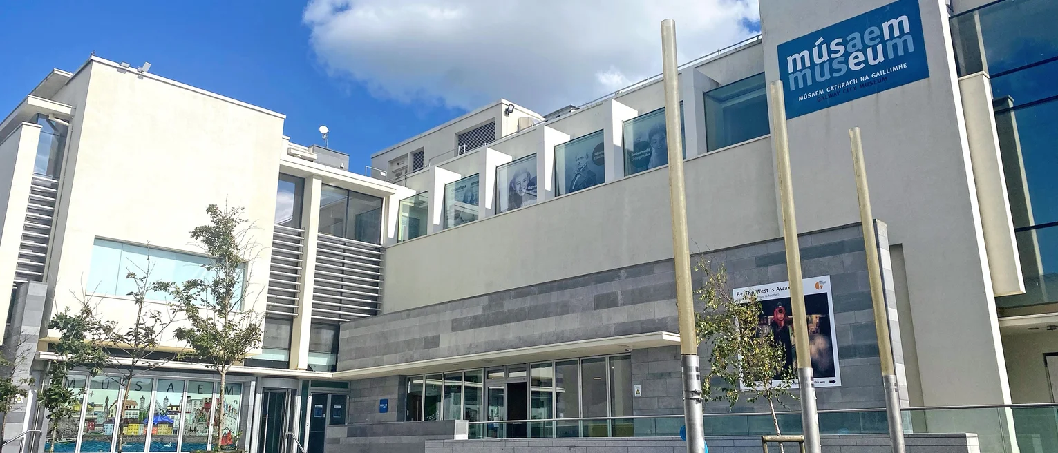 A museum building with a sign on it