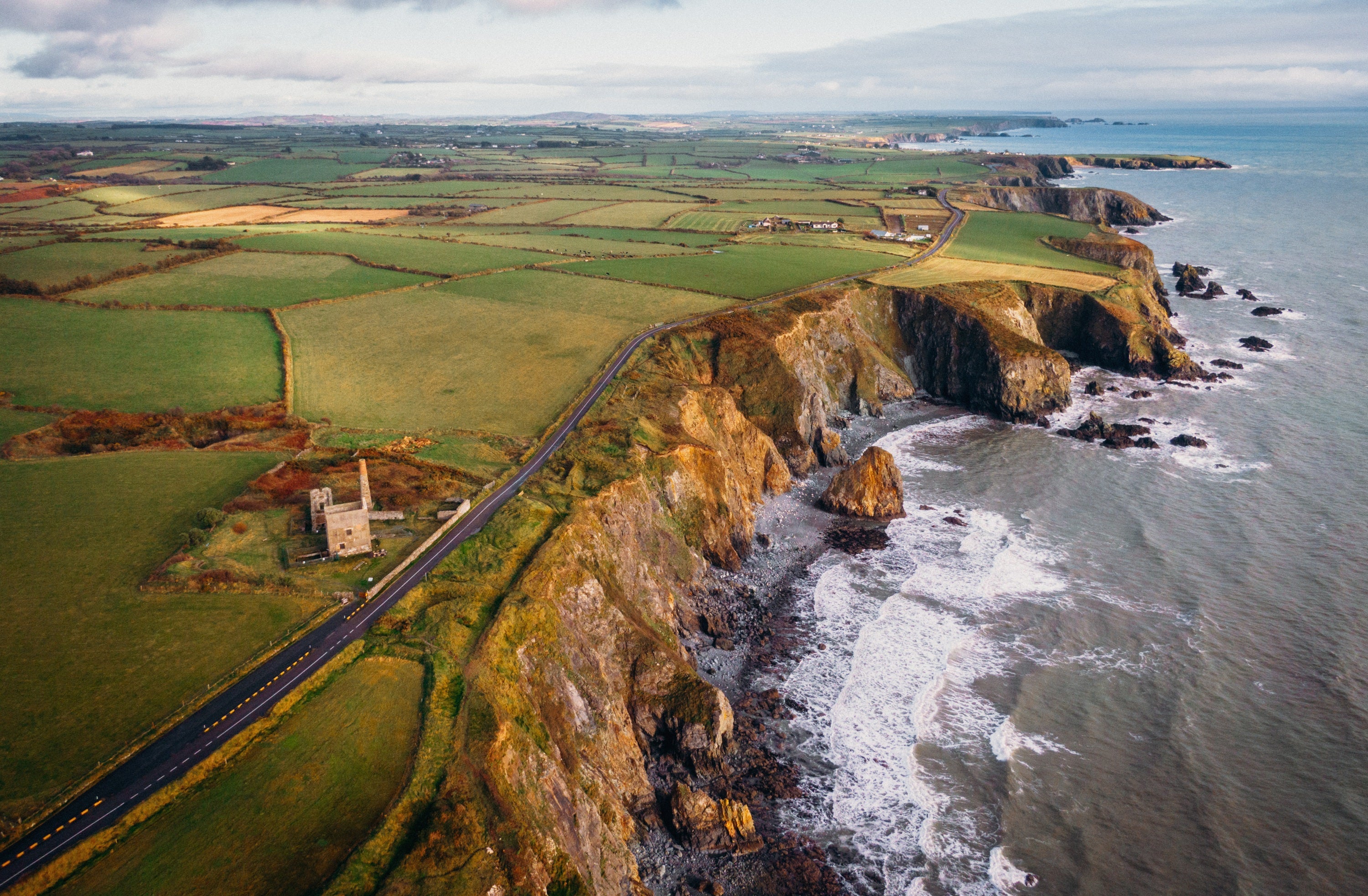 A aerial view of a road and a cliff