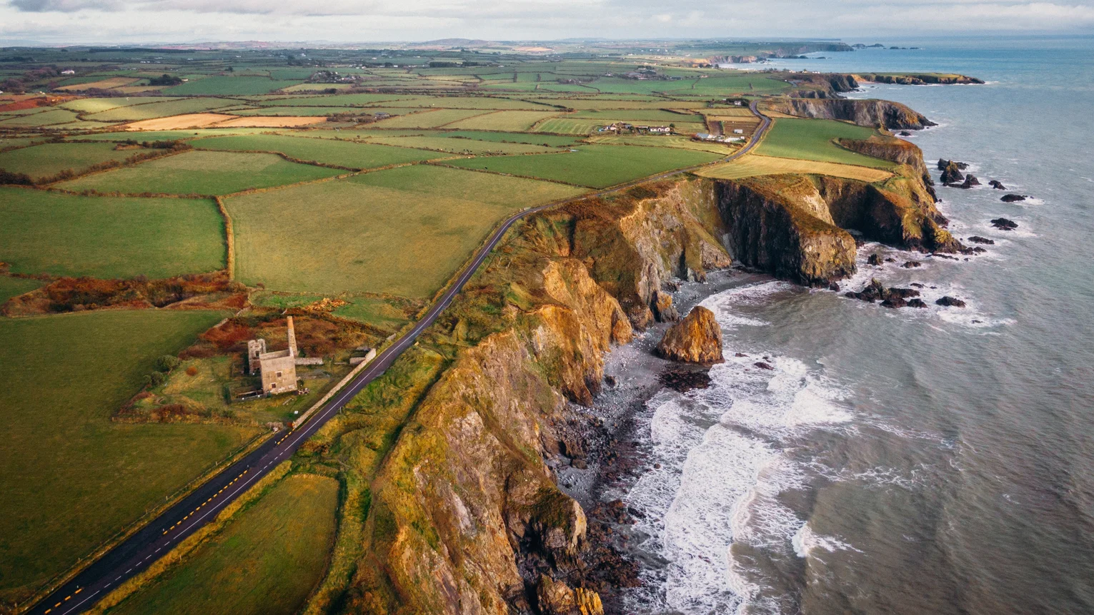 A aerial view of a road and a cliff