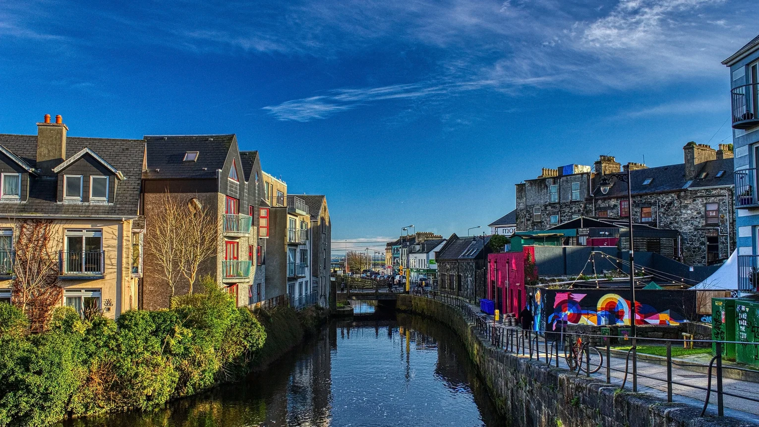 A canal with buildings and a bridge