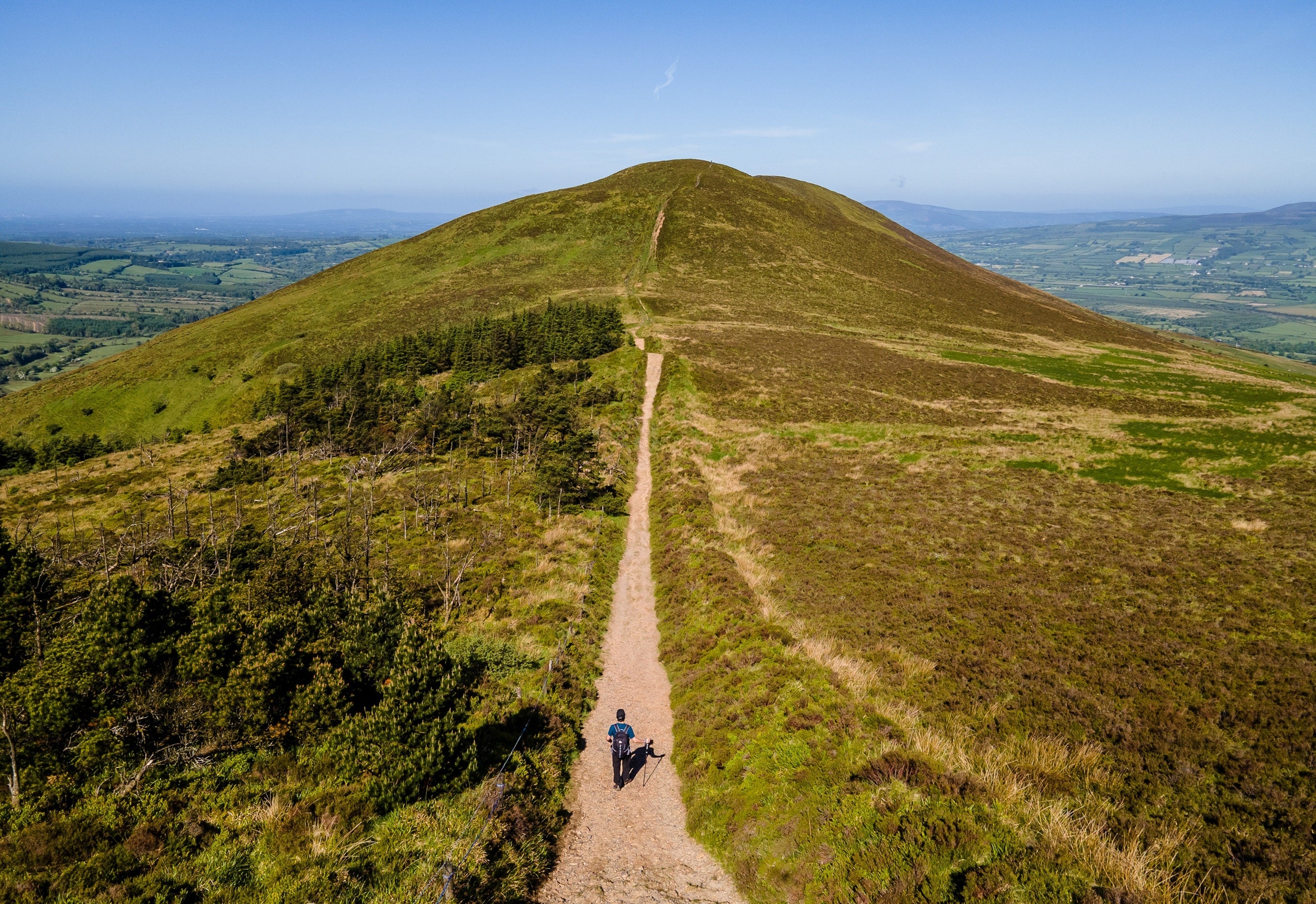 A person walking on a mountain trail
