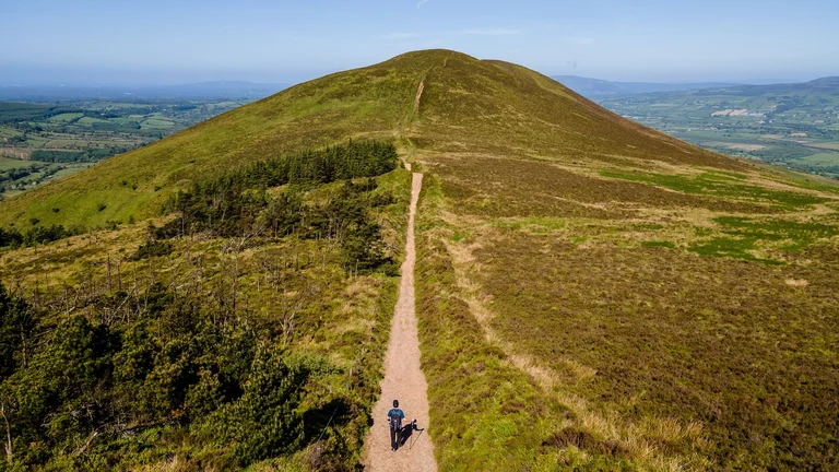 A person walking on a mountain trail
