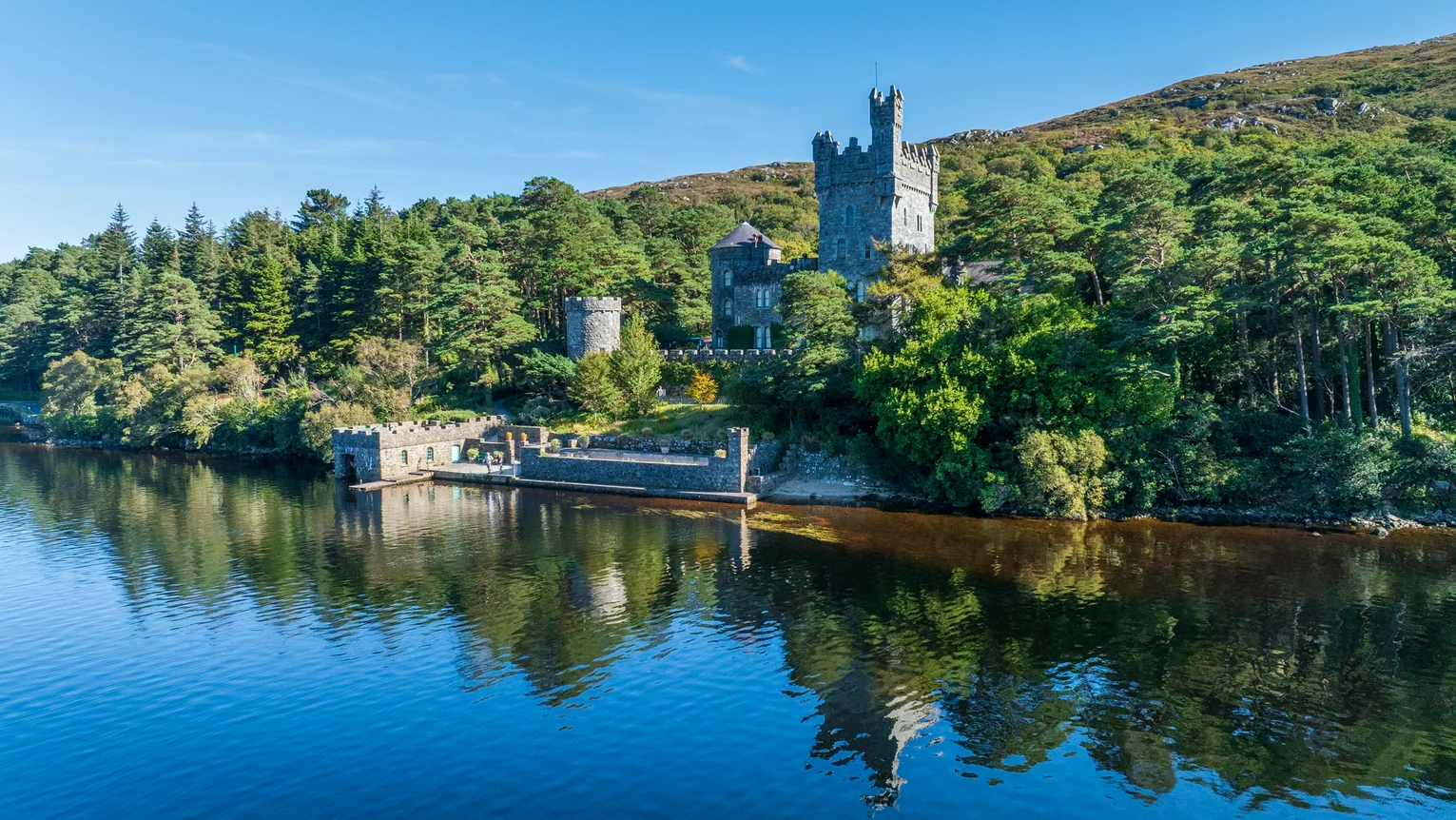 A castle on the hill by a lake